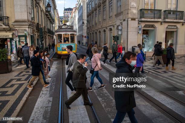 People walk near the tram tracks in the Baixa district, Lisbon. November 26, 2021. Prime Minister António Costa said that the omicron variant of...