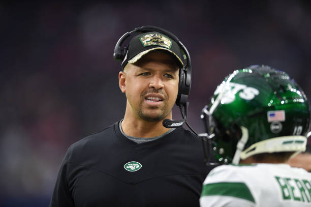 New York Jets assistant coach Miles Austin chats with some players during game featuring the Houston Texans and the New York Jets on November 28,...