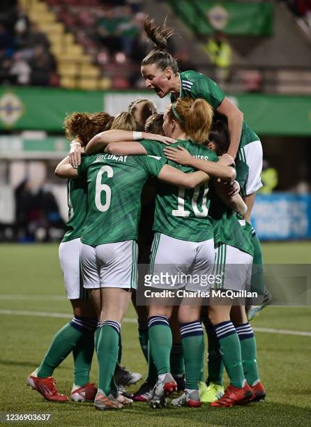 Rebecca Holloway of Northern Ireland celebrates with team mates after scoring during the World Cup 2023 qualifier between Northern Ireland and North...