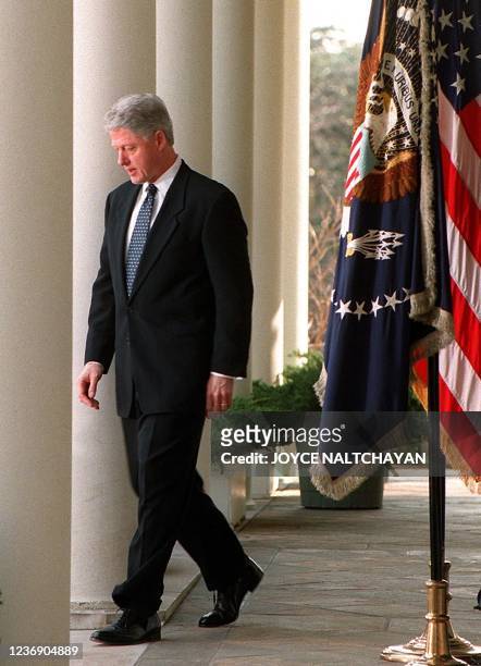 President Bill Clinton walks out to make a statement to the media 12 February in the Rose Garden at the White House in Washington, DC. Clinton...