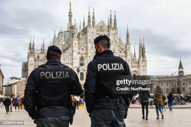 Policemen walk on Piazza del Duomo in Milan, Italy on October 6, 2021.