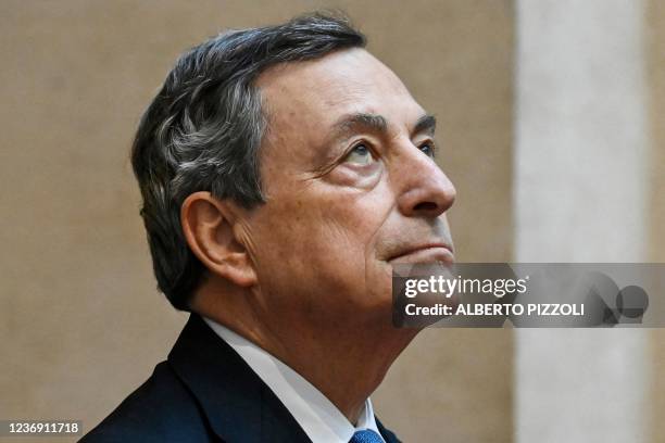 Italy's Prime Minister, Mario Draghi stands at attention as he welcomes the Indian Prime Minister upon his arrival for their meeting at the Chigi...