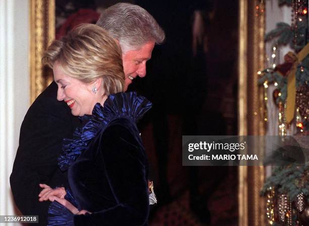 President Bill Clinton and wife Hillary Rodham Clinton are pictured during a ceremony honoring Kennedy Center awardees 05 December 1999 at the White...