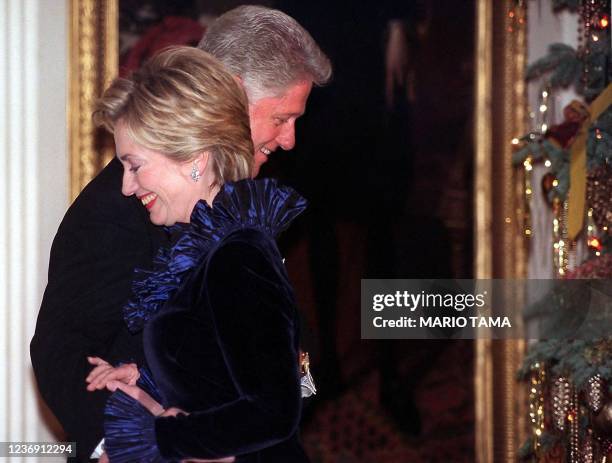 President Bill Clinton and wife Hillary Rodham Clinton are pictured during a ceremony honoring Kennedy Center awardees 05 December 1999 at the White...