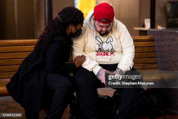 Damik Wright , brother of Daunte Wright, prays in the lobby of the Hennepin County Government Center on November 30, 2021 in Minneapolis, Minnesota....