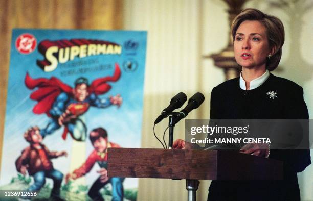 First Lady Hillary Rodham Clinton unveils a Superman comic book for children in Kosovo to provide information on the dangers of landmines 02 August...