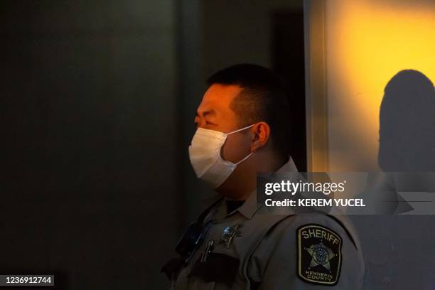 Hennepin County Sheriff stands guard at Hennepin County Government Center in Minneapolis, Minnesota on November 30, 2021. - Jury selection begins...
