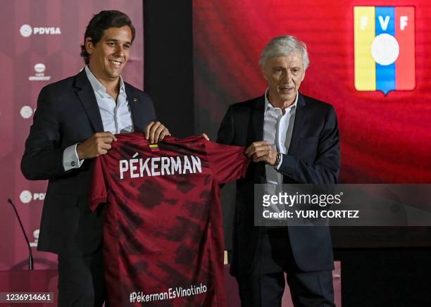 Argentine Jose Nestor Pekerman receives the jersey of the Venezuelan national football team from the president of the Venezuelan Football Federation...