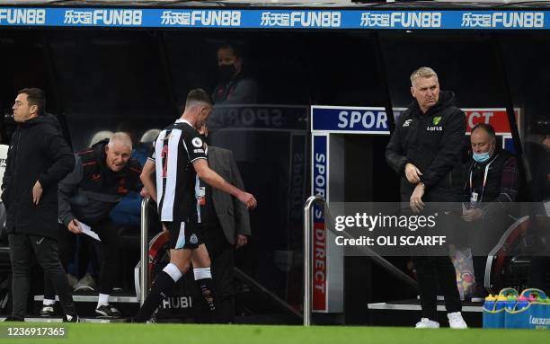 Newcastle United's Irish defender Ciaran Clark leaves the pitch after being shown a red card during the English Premier League football match between...