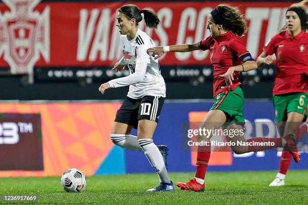 Dzenifer Marozsan of Germany Women challenges Dolores Silva of Portugal Women during the FIFA Women's World Cup 2023 Qualifier group H match between...