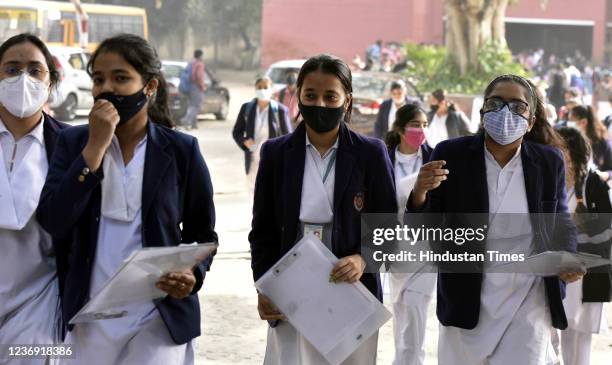 Students outside an examination centre after appearing in the CBSE 10th Social Science Theory Board Exams 2022 for Term-1, at Kerala school on...