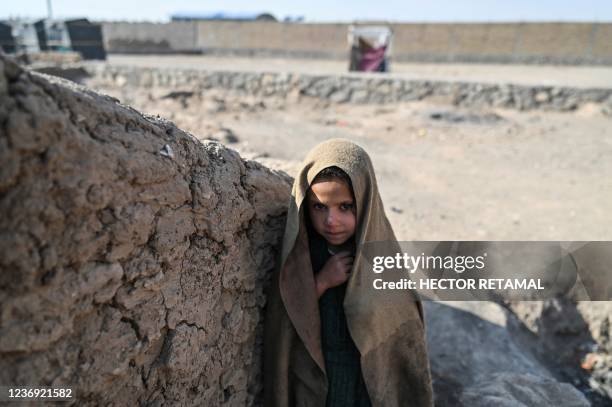 This picture taken on November 22, 2021 shows a child standing at a camp for internally displaced people where staff members from Doctors Without...