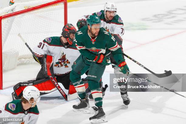 Jordan Greenway of the Minnesota Wild scores a goal against Kyle Capobianco and Scott Wedgewood of the Arizona Coyotes during the game at the Xcel...