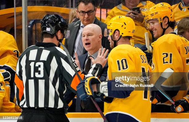 Nashville Predators head coach John Hynes voices his displeasure with a call against Mark Borowiecki to referee Dan O'Halloran during an NHL game...