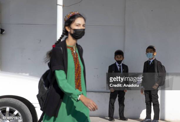 Turkmen student walks at a street in Ashgabat, Turkmenistan on November 30, 2021.