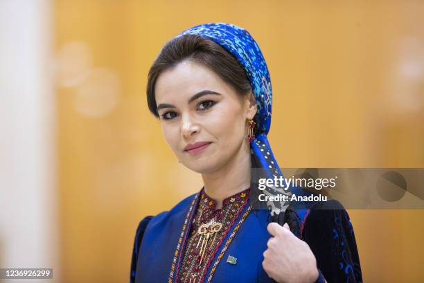 Turkmen media members wearing traditional casual dresses attend the meeting of Economic Cooperation Organization in Ashgabat, Turkmenistan on...