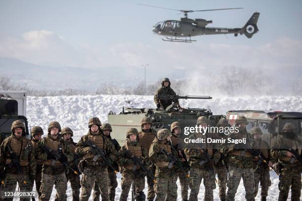 Members of Bosnias joint armed forces take a part in military exercise as the army marks its 16th anniversary, on November 30, 2021 in Rajlovac, near...