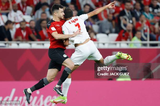 Lebanon's forward Fadel Antar vies for the ball with Egypt's defender Mahmoud Hamdy during the FIFA Arab Cup 2021 group D football match between...