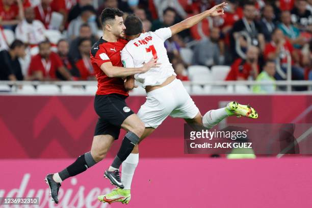 Lebanon's forward Fadel Antar vies for the ball with Egypt's defender Mahmoud Hamdy during the FIFA Arab Cup 2021 group D football match between...