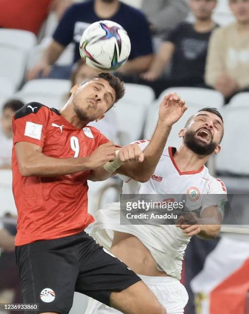 Mohamed Sherif of Egypt in action against Maher Sabra of Lebanon during FIFA Arab Cup 2021 Group D match between Egypt and Lebanon at Al Thumama...
