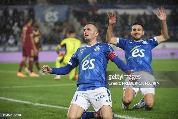 Strasbourg's French midfielder Dimitri Lienard celebrates scoring his team's fourth goal during the French L1 football match between RC Strasbourg...