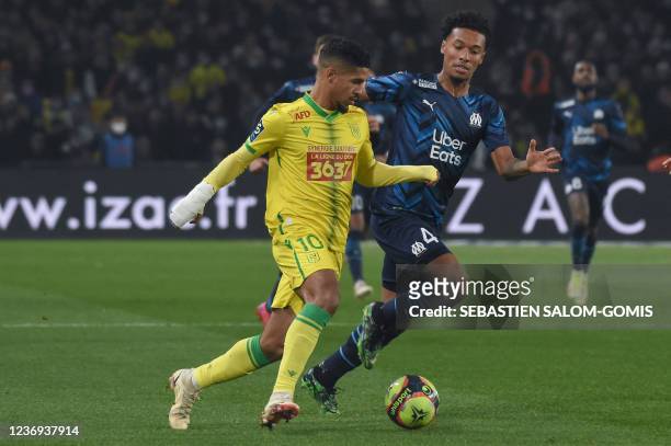 Nantes' French midfielder Ludovic Blas fights for the ball with Marseille's French defender Boubacar Kamara during the French L1 football match...