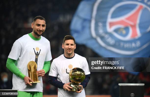 Paris Saint-Germain's Argentinian forward Lionel Messi pose with his men's Ballon d'Or award next to Paris Saint-Germain's Italian goalkeeper...