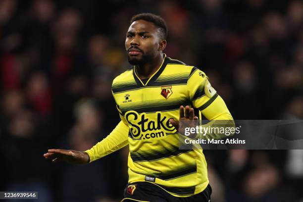 Emmanuel Dennis of Watford celebrates scoring the equalising goal during the Premier League match between Watford and Chelsea at Vicarage Road on...