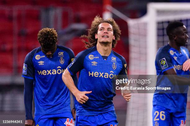 Wout Faes of Reims celebrating his goal with his teammates during the Ligue 1 Uber Eats match between Olympique Lyon and Stade de Reims at Groupama...