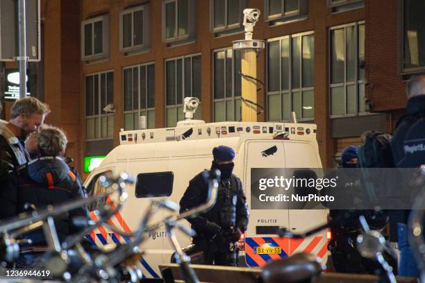 Protest against the Covid-19 measures in The Hague in front of Den Haag Centraal railway station in the city center and the canal, after the press...