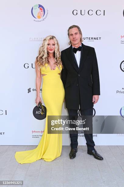 Caprice Bourret and Ty Comfort attend the mothers2mothers 20th Anniversary Gala at Outernet London on December 1, 2021 in London, England.