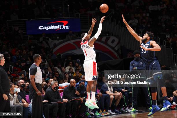 Kentavious Caldwell-Pope of the Washington Wizards shoots a three point basket during the game against the Minnesota Timberwolves on December 1, 2021...