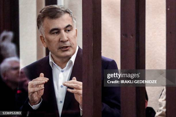 Georgian former President Mikheil Saakashvili speaks from the defendant's box during his trial for his alleged role in a violent police crackdown on...