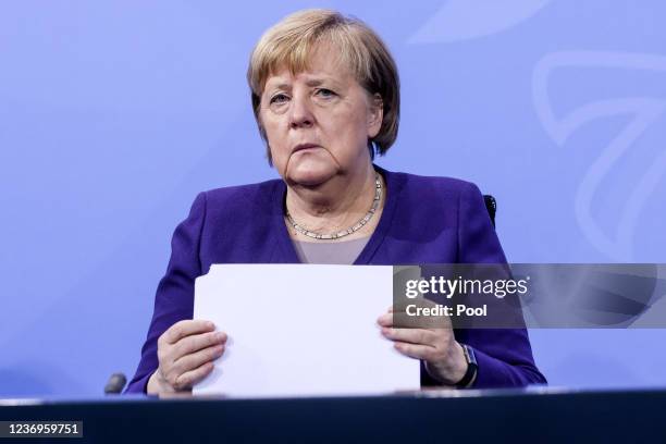 German Chancellor Angela Merkel attends a press conference after a video conference with German State Premiers about the current coronavirus...