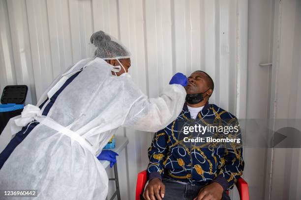 Health worker administers a nasal swab test at a Testaro Covid-19 mobile testing site outside Richmond Corner shopping center in the Milnerton...