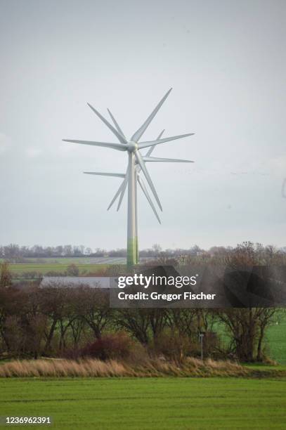 Multiple wind turbines are seen standing one behind the other on Fehmarn island on December 2, 2021 near Puttgarden, Germany. The 18km-long undersea...