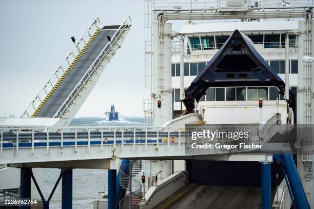 Scandlines ferry leaves the ferry terminal next to the construction site of the new Fehmarn Belt Fixed Link Tunnel on December 2, 2021 near...