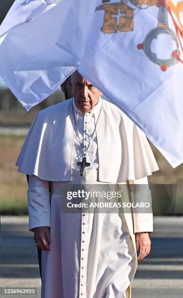 Pope Francis walks on the Red Carpet upon his arrival in the southern port city of Larnaca on December 2, 2021 at the start of a landmark trip to...