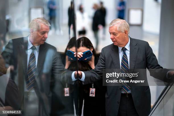 Sen. Lindsay Graham talks with reporters on his way to a vote at the U.S. Capitol on December 2, 2021 in Washington, DC. With a deadline at midnight...