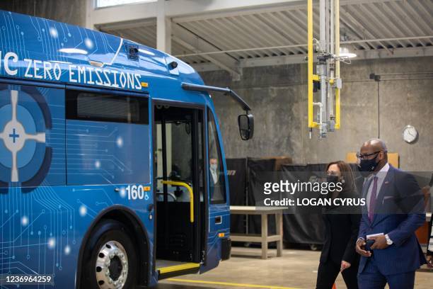Vice President Kamala Harris tours the electric vehicle operations at Charlotte Area Transit Systems bus garage with CATS CEO John Lewis in...