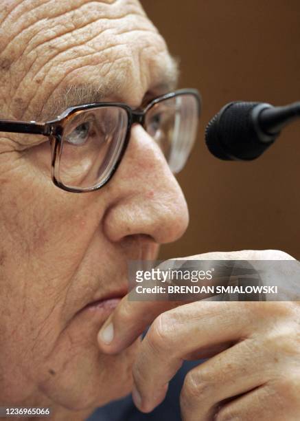 Henry Kissinger, former US Secretary of State, listens to questions during a House International Relations Committee on Capitol Hill 10 February,...