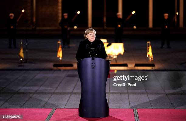 Outgoing German Chancellor Angela Merkel delivers a speech as she attends her military tattoo ceremony hosted by the Bundeswehr on December 02, 2021...