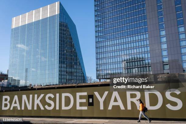 Construction hoarding at the new development of Bankside Yards with a background of office towers on the Southbank in Southwark, on 2nd December...