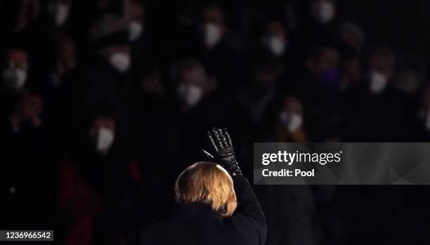 Outgoing German Chancellor Angela Merkel leaves the military tattoo ceremony hosted for her by the Bundeswehr on December 02, 2021 in Berlin,...