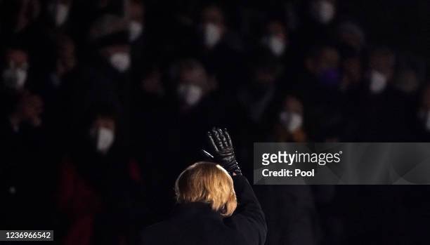 Outgoing German Chancellor Angela Merkel leaves the military tattoo ceremony hosted for her by the Bundeswehr on December 02, 2021 in Berlin,...