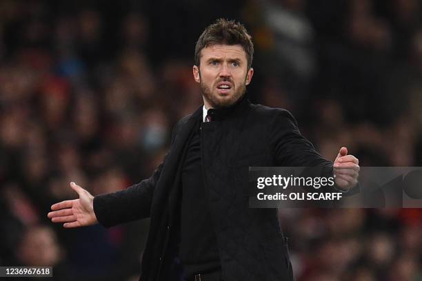 Manchester United's English caretaker manager Michael Carrick gestures on the touchline during the English Premier League football match between...