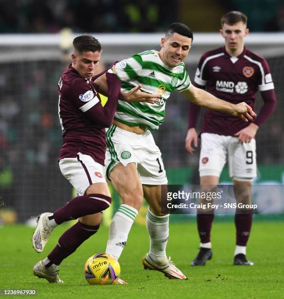 Celtic's Tom Rogic and Cammy Devlin in action during a cinch Premiership match between Celtic and Heart of Midlothian at Celtic Park, on December 02...