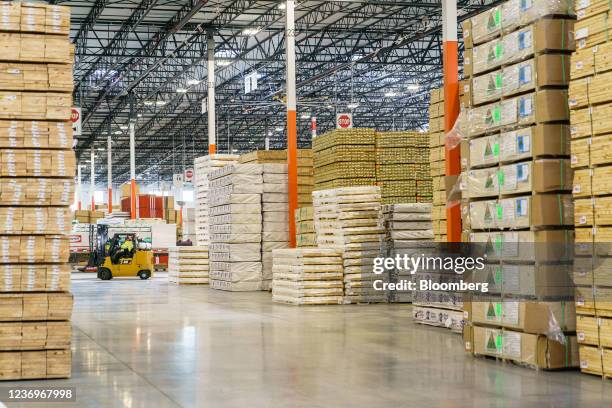 An employee operates a forklift inside the Home Depot flatbed distribution center in Stonecrest, Georgia, U.S., on Tuesday, Nov. 30, 2021. The...