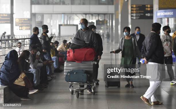 International passengers arrive at Indira Gandhi International Airport t-3, after Omicron Covid Variant identified on December 2, 2021 in New Delhi,...