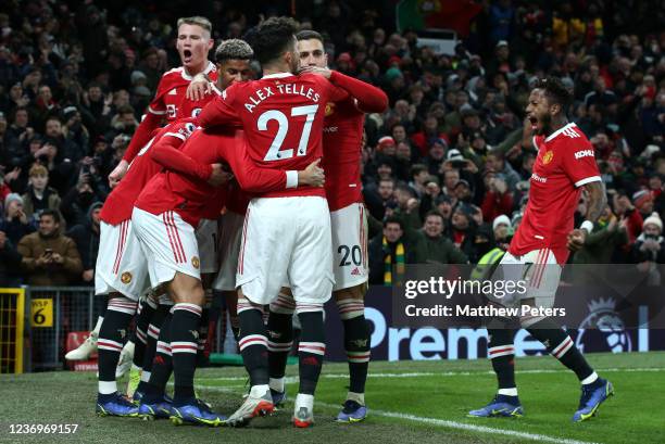 Cristiano Ronaldo of Manchester United celebrates scoring a goal to make the score 3-2 with team-mates during the Premier League match between...